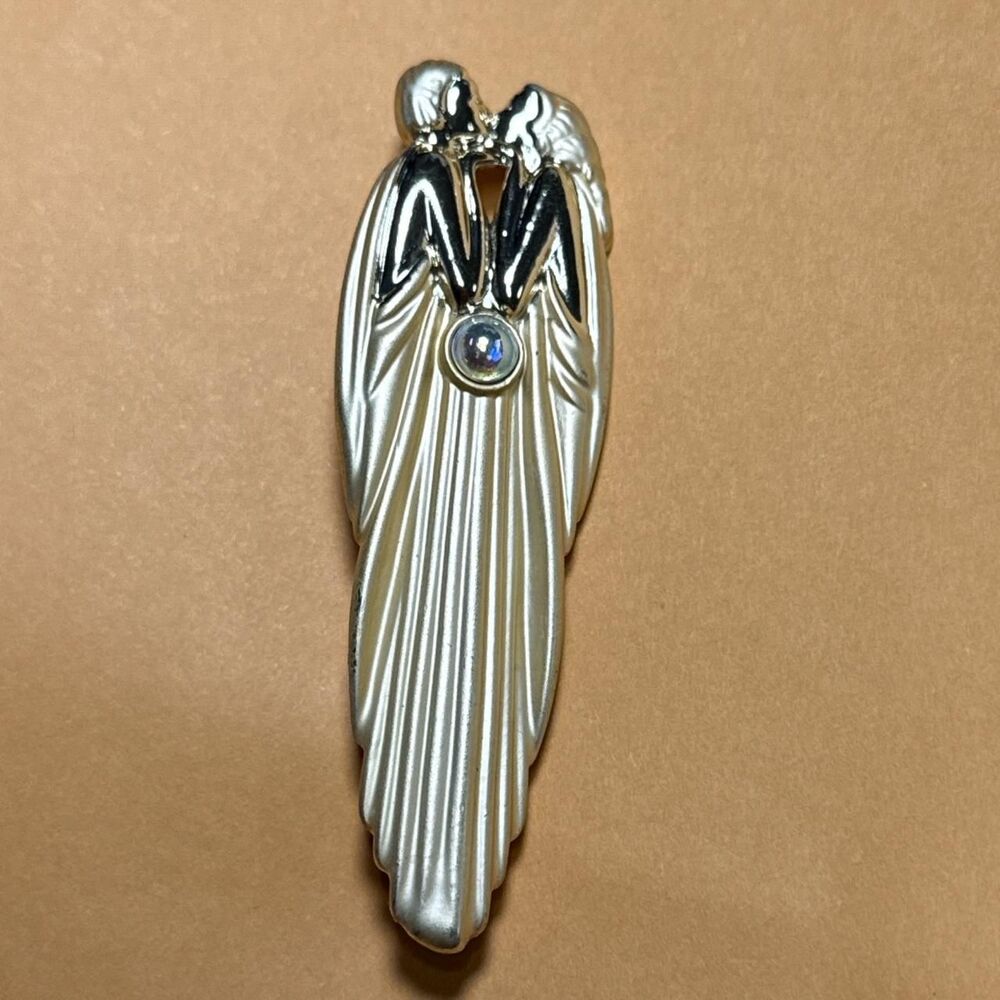 Vintage gold tone AJC “Kissing Couple” brooch/pin with center iridescent stone.